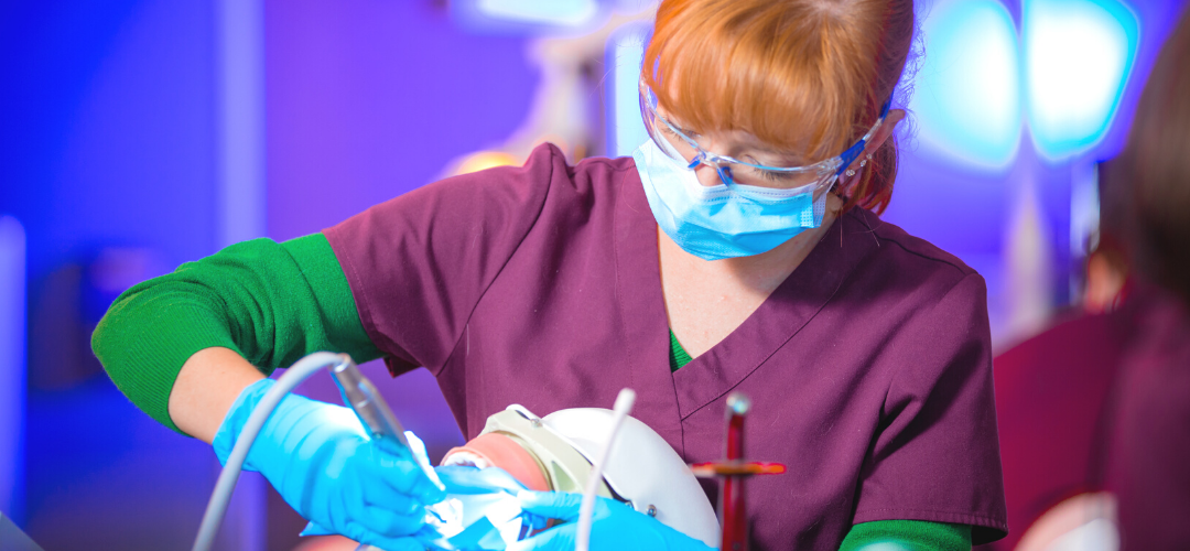 Woman student working in dental medicine at Roseman University.